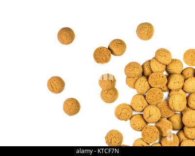 Handful of Scattered Pepernoten cookies as Sinterklaas decoration on white background for dutch sinterklaasfeest holiday event on december 5th Stock Photo