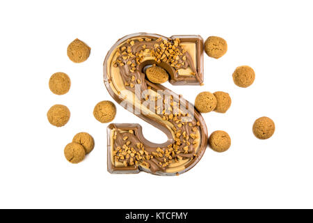 Decorated Chocolate letter with bunch ginger nuts or pepernoten as Sinterklaas decoration on white background for dutch sinterklaasfeest holiday event Stock Photo