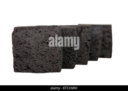 Group of charcoal cubes isolated on white background. Stock Photo