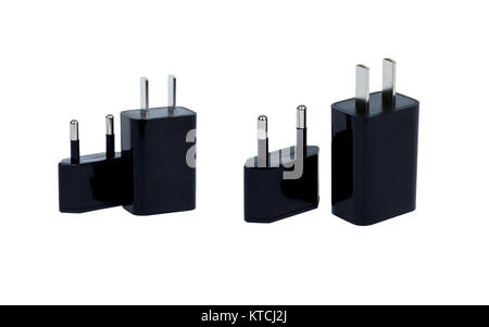 A flat pin power plug and a round pin adapter. Theme: Adaptation to a changing local environment culture in order to survive compete. Stock Photo