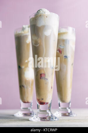 Tall root beer floats on a pastel background. Stock Photo
