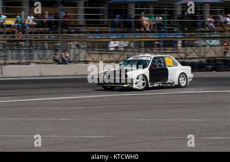 Lviv, Ukraine - Juny 6, 2015: Unknown rider on the car brand BMW overcomes the track in the championship of Ukraine drifting in Lviv. Stock Photo