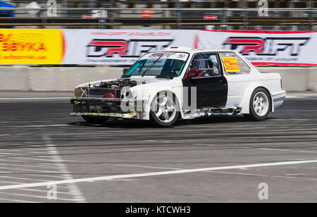 Lviv, Ukraine - Juny 6, 2015: Unknown rider on the car brand BMW overcomes the track in the championship of Ukraine drifting in Lviv. Stock Photo