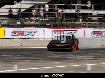 Lviv, Ukraine - Juny 6, 2015: Unknown rider on the car brand Nissan overcomes the track in the championship of Ukraine drifting in Lviv. Stock Photo