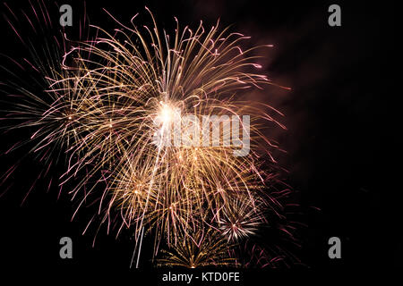 Firework blast in dark sky at night celebration new year,count down event,abstract lights explosion Stock Photo