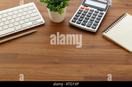 Calculator and computer keyboard on wooden table with copy space for finacial accounting concept Stock Photo