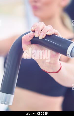 Beautiful fit woman works out in a fitness gym Stock Photo
