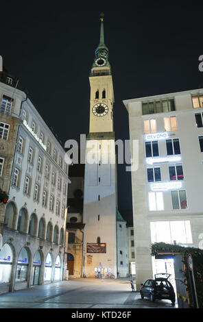 MUNICH, GERMANY - DECEMBER 11, 2017 : A view of the Saint Peters Church at night in center of Munich, Germany. Stock Photo
