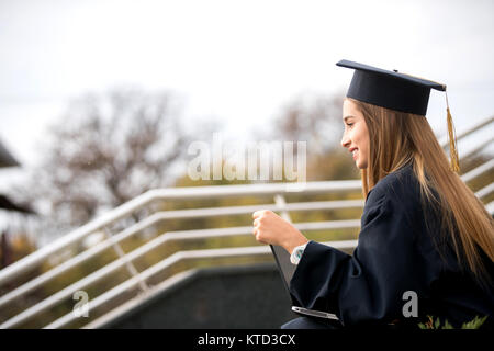pretty young girl graduation day pose diploma