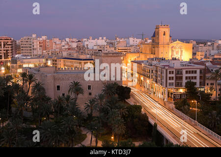 Views of Elche city at sunset in front of the palm grove. Province of Alicante in Spain. Stock Photo