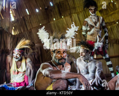 YOUW VILLAGE, ATSY DISTRICT, ASMAT REGION, IRIAN JAYA, NEW GUINEA, INDONESIA - MAY 23, 2016: Portrait of a man from the tribe of Asmat people with rit Stock Photo