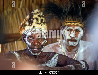 YOUW VILLAGE, ATSY DISTRICT, ASMAT REGION, IRIAN JAYA, NEW GUINEA, INDONESIA - MAY 23, 2016: Portrait of a man from the tribe of Asmat people with rit Stock Photo