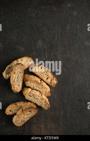 Traditional and tasty biscotti doublr baked on dark background. Stock Photo