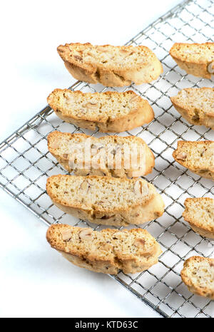 Traditional and tasty biscotti doublr baked on a rack and white background. Stock Photo