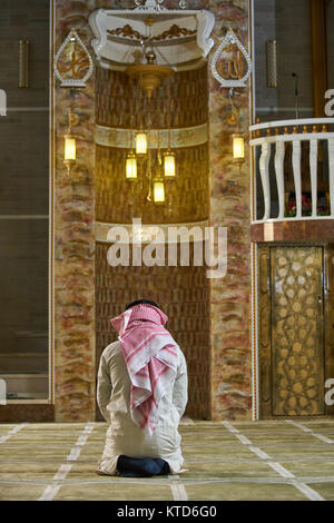 Religious muslim man praying inside the mosque Stock Photo