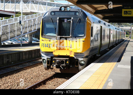 Two 2-car Matangi electric multiple units arriving at Petone station with a passenger train to Wellington on 22nd November 2017. Stock Photo