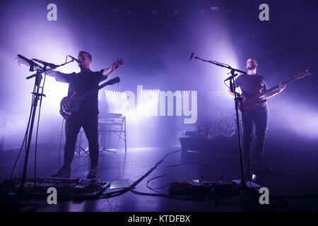 The English indie rock and post-punk band White Lies performs a live concert at VEGA in Copenhagen. Here lead singer and guitarist Harry McVeigh is seen live on stage with bass player Charles Cave. Denmark, 25/10 2016. Stock Photo