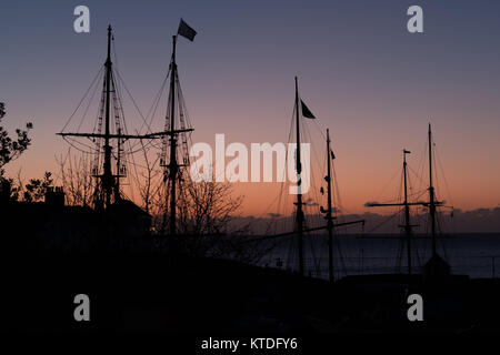 Square rigged tall ships picked in Charlestown, Cornwall, at sunrise Stock Photo