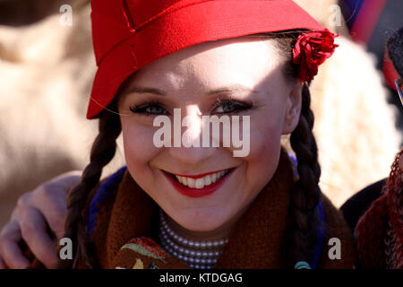 Pernik, Bulgaria - January 31, 2015: Unidentified Woman with traditional Kukeri costume are seen at the Festival of the Masquerade Games Surva in Pern Stock Photo