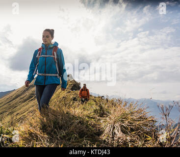 Germany, Bavaria, Oberstdorf, two hikers walking on mountain ridge Stock Photo