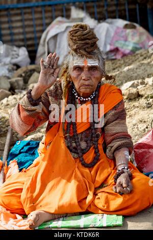 Sadhvi ( a female sadhu) giving blessing at Kumbh Mela Allahabad 2013, Sangam, Allahabad Stock Photo