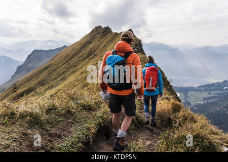 Germany, Bavaria, Oberstdorf, two hikers walking on mountain ridge Stock Photo