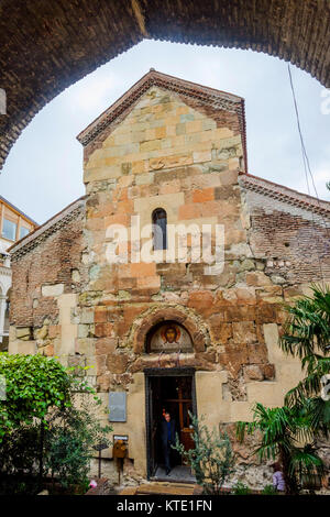 TBILISI, GEORGIA - OCTOBER 16: Man exiting Anchiskhati basilica, old church from 6th century in Tbilisi old town. October 2016 Stock Photo