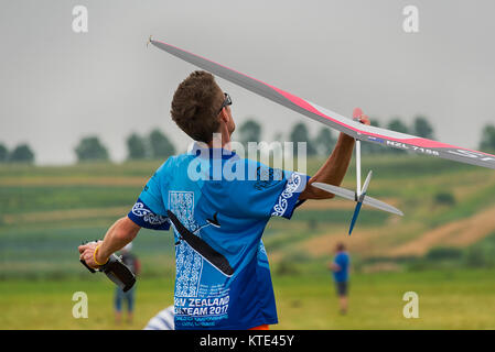 Lviv, Ukraine - July 23, 2017: Unknown aircraft modeler  launches his own radio-controlled  model  glider  in the countryside near the city of Lviv.,  Stock Photo