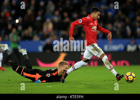 Leicester City goalkeeper Kasper Schmeichel (right) and Manchester United's Jesse Lingard (left) during the Premier League match at the King Power Stadium, Leicester. Stock Photo