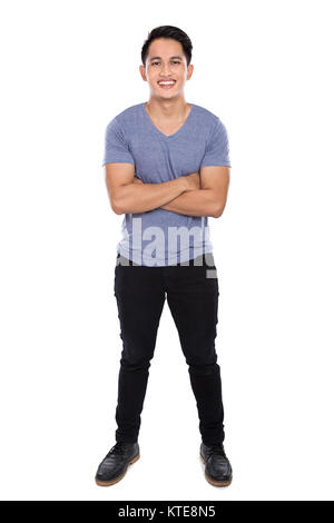 Young asian man posing on the white background, crossed arms Stock Photo