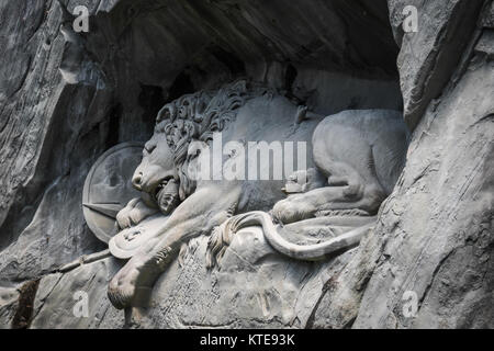 Lewendenkmal, the lion monument landmark in Lucerne, Switzerland. It was carved on the cliff to honor the Swiss Guards of Louis XVI of France. Stock Photo