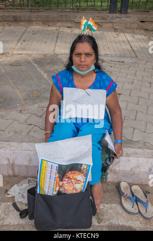 Portrait of woman sitting on footpath demonstrating in front of Karnataka Assembly in Bangalore, Bengaluru, Karnataka, India, Asia. Stock Photo