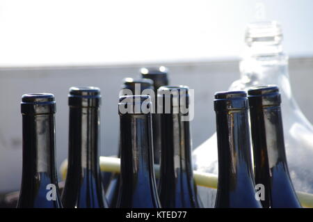 Empty wine bottles close-up isolated over white background Stock Photo