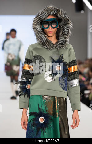 A model walks the runway wearing a collection created by Beth Woolley from Liverpool John Moores University during Graduate Fashion Week 2017 at the Old Truman Brewery. Graduate Fashion Week is an annual event that showcases recent graduates' collections from the UK's leading fashion colleges and university courses in a series of fashion shows and exhibitions. Stock Photo