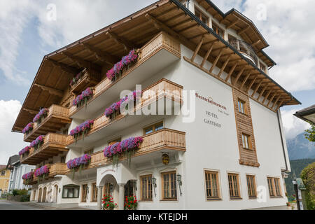 HAUS, AUSTRIA - SEPTEMBER 24, 2017: Herrschaftstaverne hotel facade. Haus village is a small winter resort located in Styria, Austria. Stock Photo