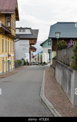 HAUS, AUSTRIA - SEPTEMBER 24, 2017: Rural Alpine street with Herrschaftstaverne hotel. Haus village is a small winter resort located in Styria, Austri Stock Photo