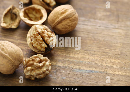 walnuts, kernel and shell on wooden background Stock Photo