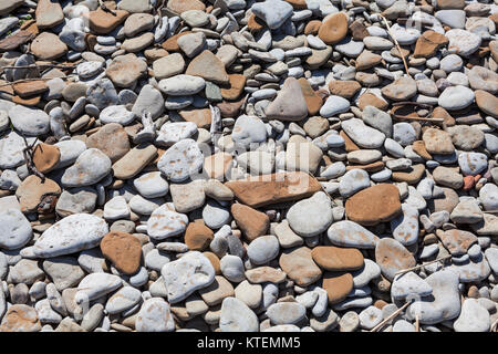 Sea pebbles. Small stones gravel texture background. Colored stone in background Stock Photo