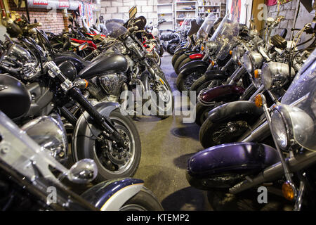 ST. PETERSBURG, RUSSIA-CIRCA OCT, 2016: Storage for bikes conservation with lines of motobikes. The Motozastava repair workshop Stock Photo