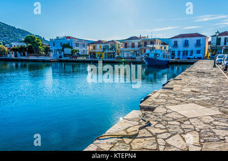 Port of Vathy old passenger ship moored facilities surrounding the harbor and in the background the hills of the island of Ithaka Stock Photo