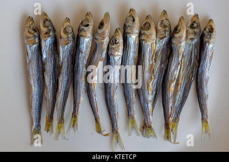 Dried herring on a plate. Stock Photo