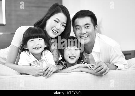 portrait of an asian family with two children, happy and smiling, black and white. Stock Photo