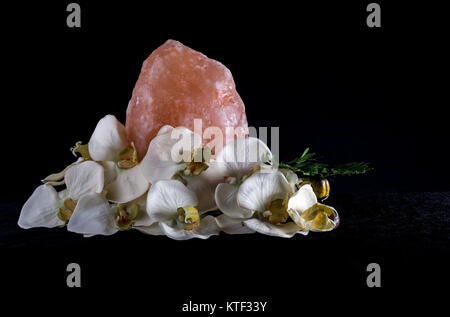 Himalayan salt lamp on black background Stock Photo