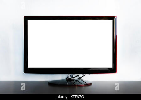 wide screen TV on wooden commode. Large black TV stands on wooden table on light blue background with blank space for information. Procurement for des Stock Photo