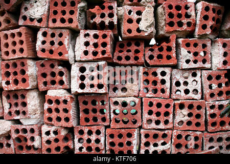 Old used bricks with holes Stock Photo