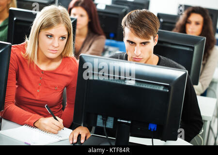 Students learning in computer lab Stock Photo - Alamy