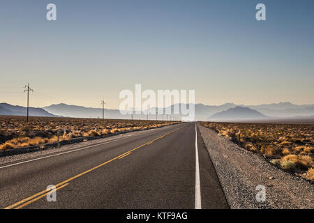 A straight road in the Death Valley National Park on early morning in summer, Death Valley National Park, California, USA. Stock Photo