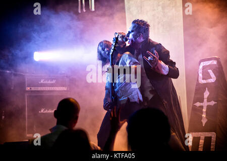 The Norwegian industrial metal band Gothminister performs a live concert at Rockefeller in Oslo. Here vocalist Gothminister (Bjørn Alexander Brem) is seen live on stage with of the band's guitarist. Norway, 31/10 2013. Stock Photo