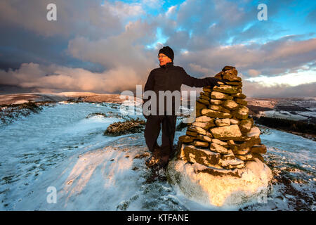 Man standing on the hill fort of Twyn y Gaer near Abergavenny in the Black Mountains, Wales Stock Photo