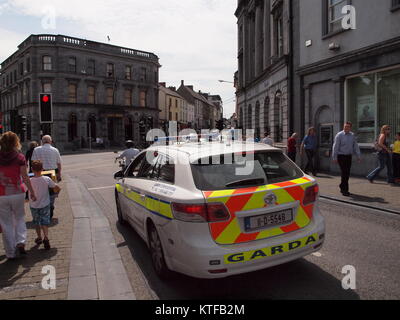 Irish Garda ( Police) car on patrol in typical Irish city setting. Stock Photo